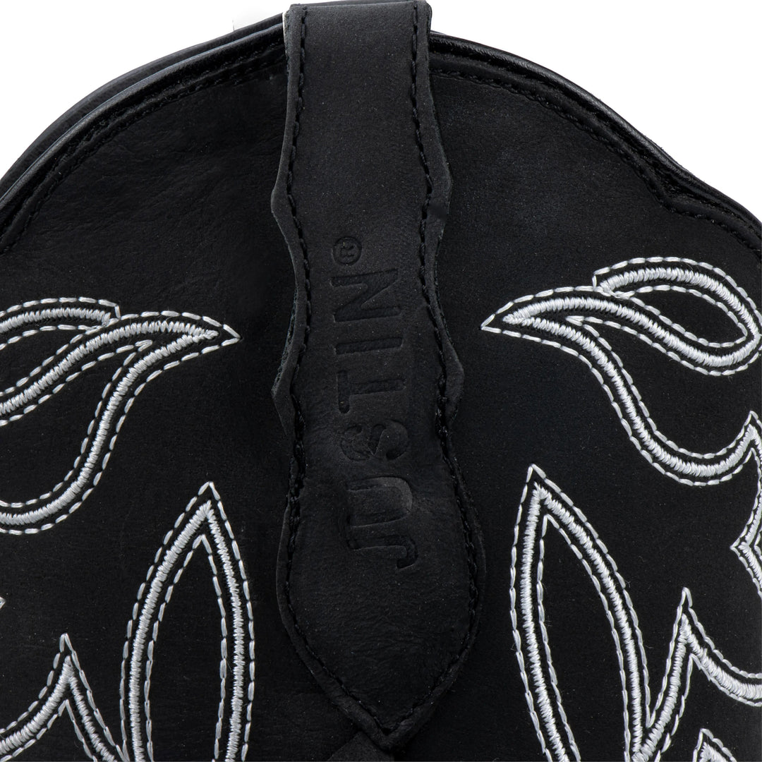 Botas vaqueras negras de piel Justin Boots para mujer con bordado blanco y detalles de flecos.