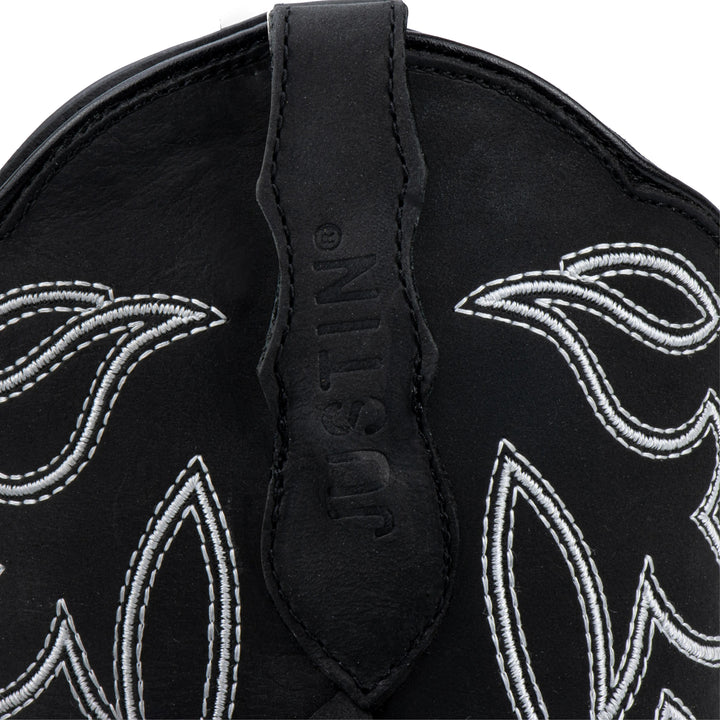 Botas vaqueras negras de piel Justin Boots para mujer con bordado blanco y detalles de flecos.