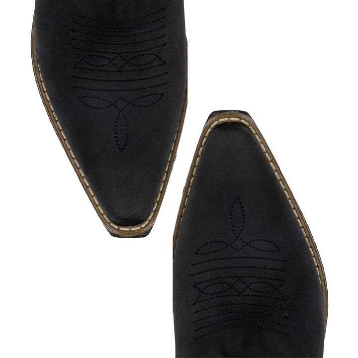 Botas vaqueras de piel negra Justin Boots México con bordado artesanal y punta afilada. Diseño moderno y cómodo para mujer.