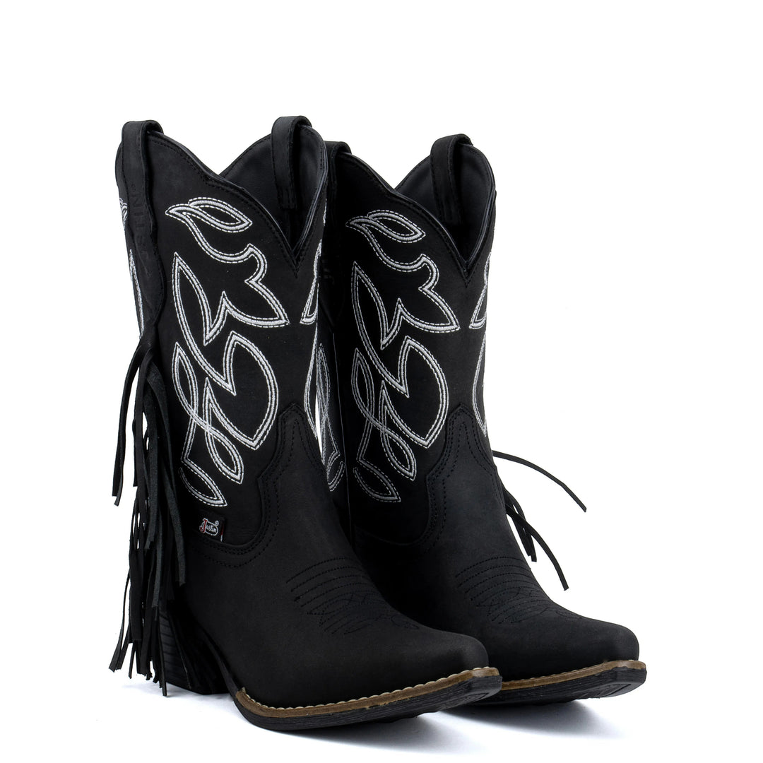 Botas vaqueras negras de piel para mujer de Justin Boots México con bordado plateado y flecos laterales.