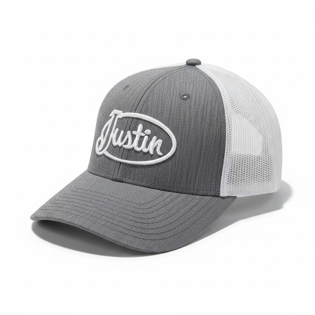 Justin Boots México gray trucker cap with white mesh back and embroidered logo. Adjustable snapback closure.